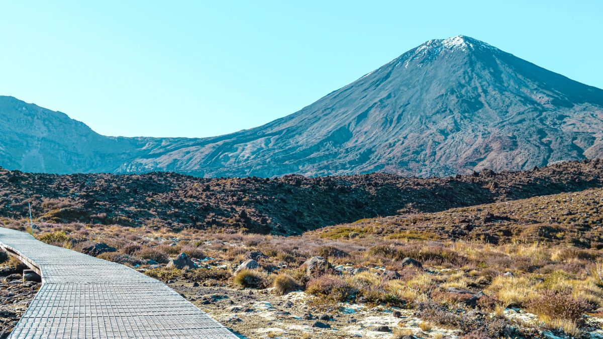 Wooden broad walk leading towards a famous volcano, Mount Ngauruhoe (or Mount Doom from Lord of the Rings), Tongariro National Park, North Island, New Zealand