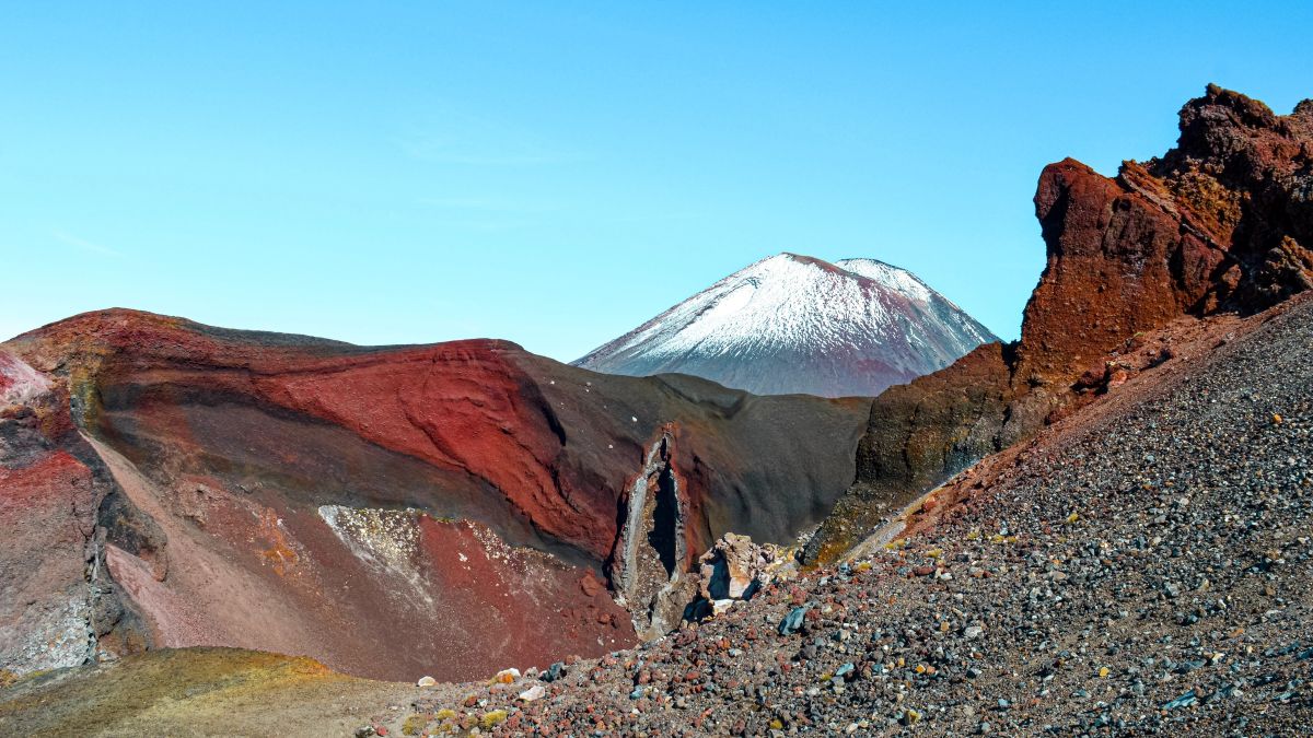 Mount Ngauruhoe (Mt Doom for LOTR fans) peaking out from behind volcanic landscape of Red Crater, Tongariro Crossing, North Island, New Zealand